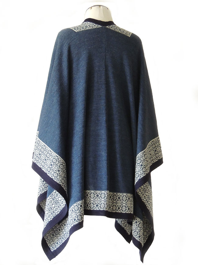 PFL Knits ruana in blue with contrasting ethnic pattern.