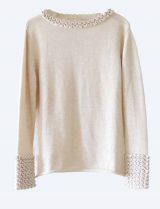Knitted sweater light beige in soft baby alpaca with a round neckline, cuffs and neck rushes pattern.