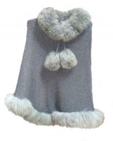 Knitted cape with baby alpaca fur trim.