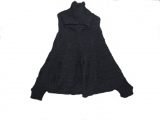 Short hand knitted cape with lapel collar and sleeves.
