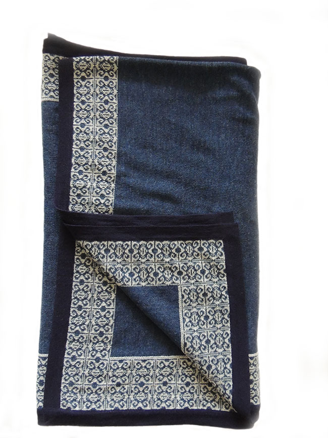 PFL Knits ruana in blue with contrasting ethnic pattern.