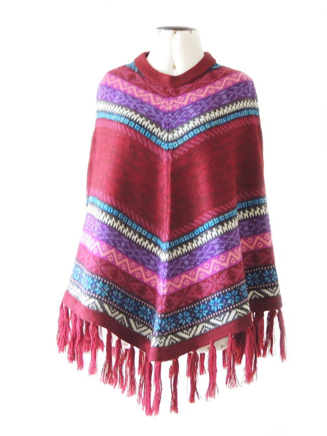 PFL cape of alpaca with fringed and ethnic patterns.
