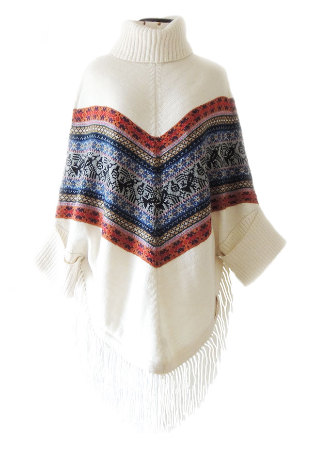 PFL cape with ethnic design, turtleneck, sleeves and fringes in alpaca blend.