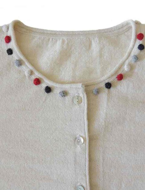 crewneck and mother of pearl button button closure