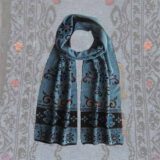 Women's scarf jacquard knitted with hand embroidered details. Scarf blue with black pattern alpaca blend scarf
